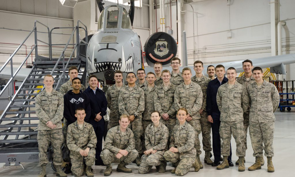 Air Force ROTC cadets standing near a plane